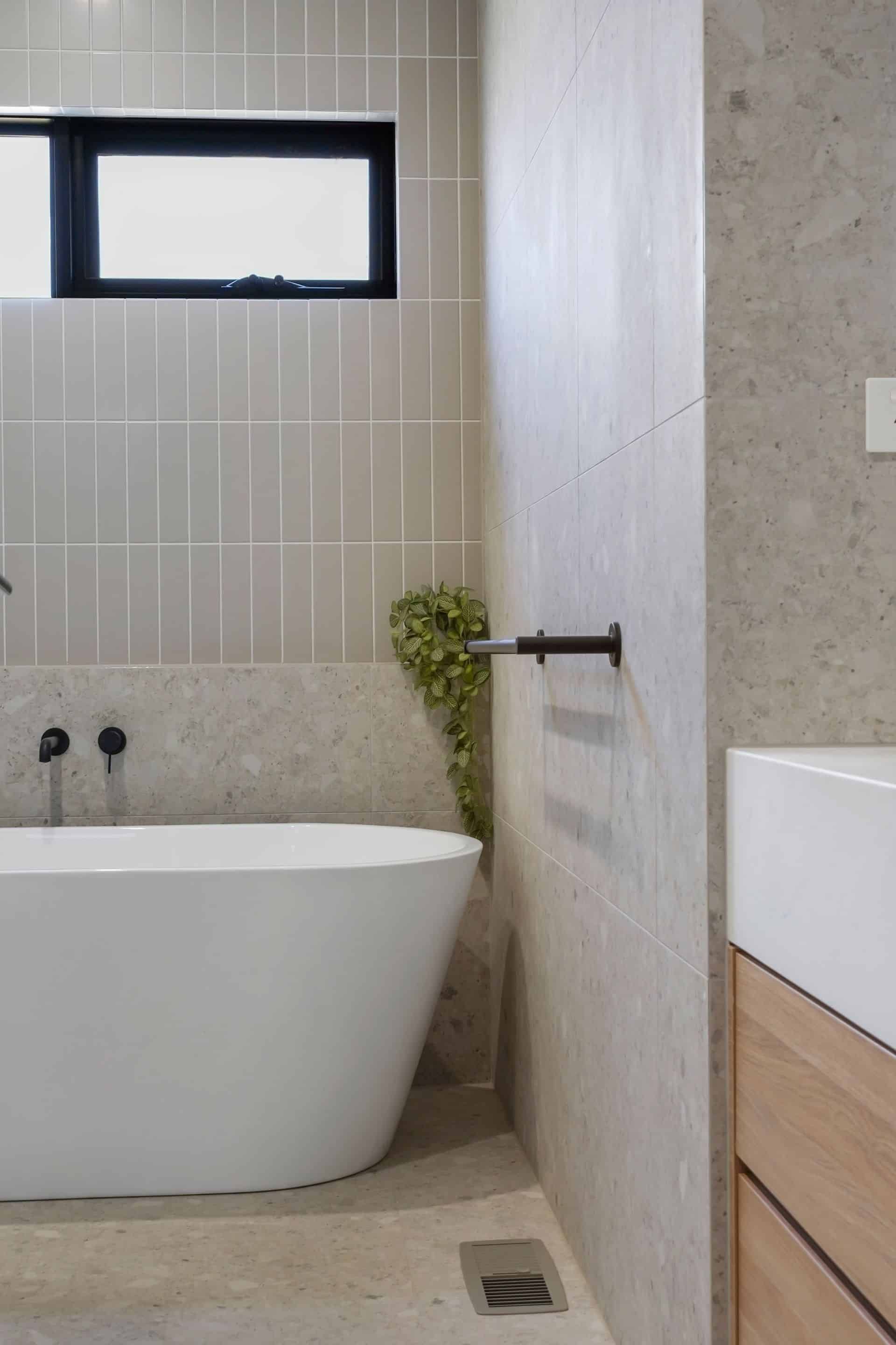 A Bathroom With a Bathtub, Sink and Window — Jetsonian Constructions In Wendouree, VIC