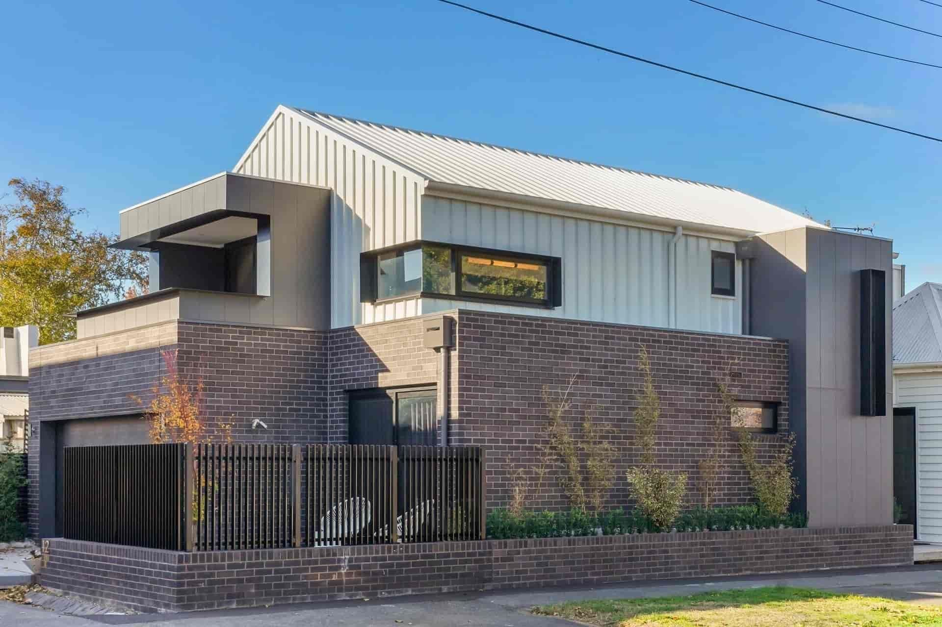 A Modern House With a Brick Wall and a White Roof — Jetsonian Constructions In Wendouree, VIC