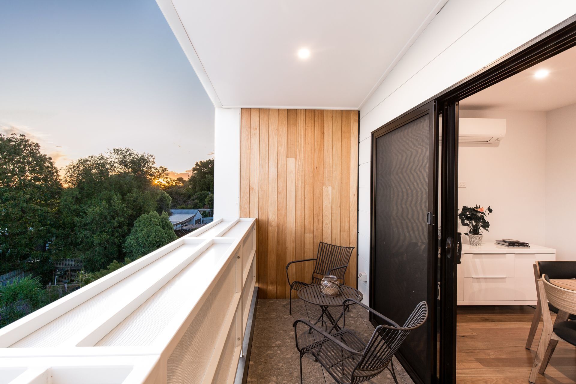 A Balcony With a Table and Chairs and a Sliding Glass Door — Jetsonian Constructions In Wendouree, VIC