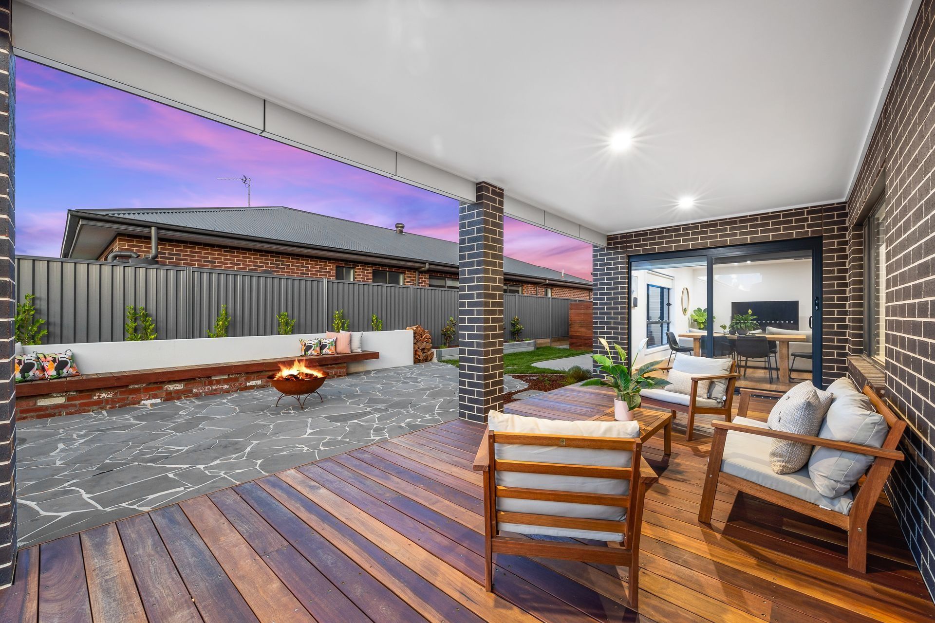 A Wooden Deck With Chairs, a Table and a Fire Pit — Jetsonian Constructions In Wendouree, VIC