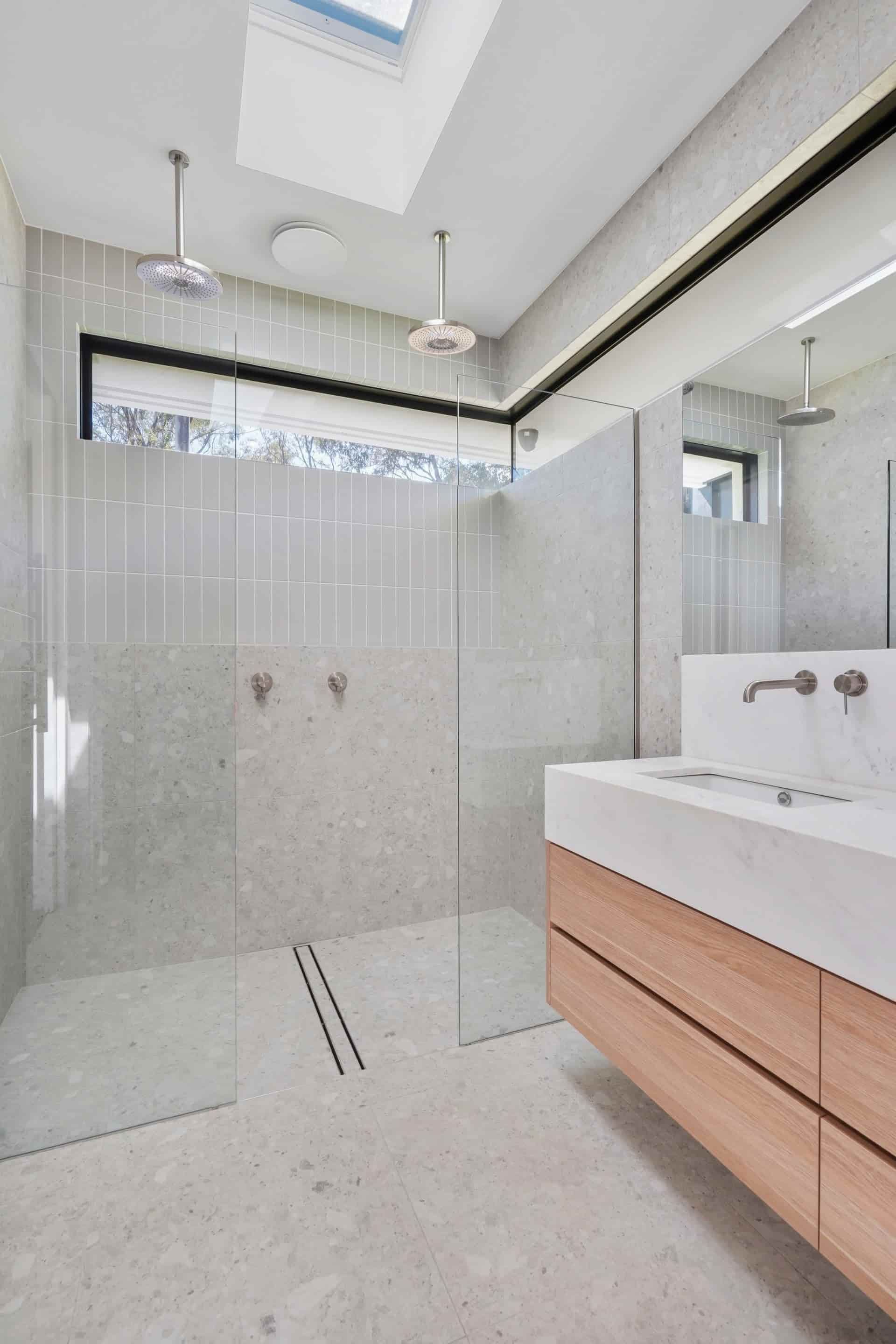 A Bathroom With a Walk in Shower, Sink, Mirror and Skylight — Jetsonian Constructions In Wendouree, VIC
