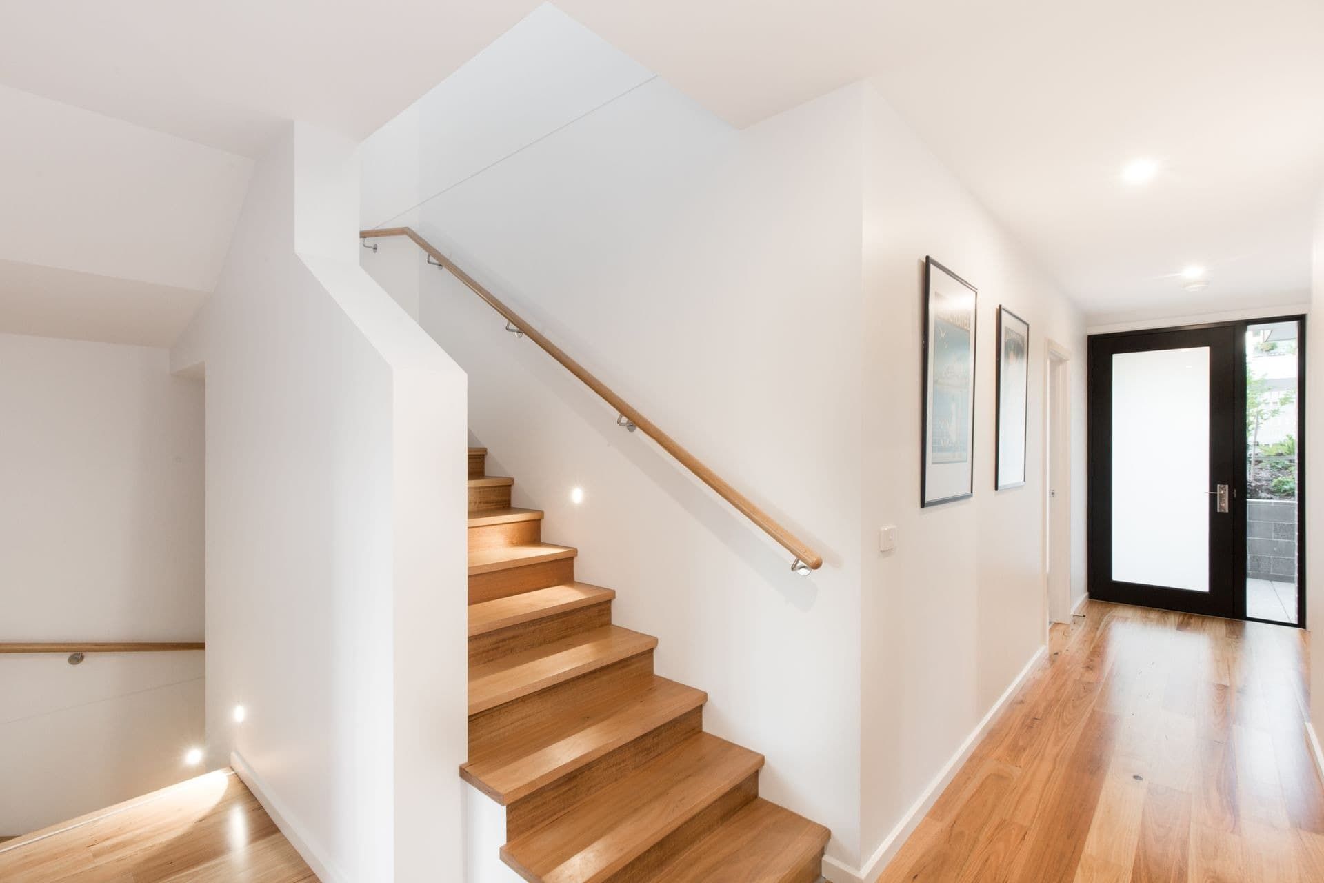 A Staircase With Wooden Steps and a Wooden Railing in a Hallway — Jetsonian Constructions In Wendouree, VIC