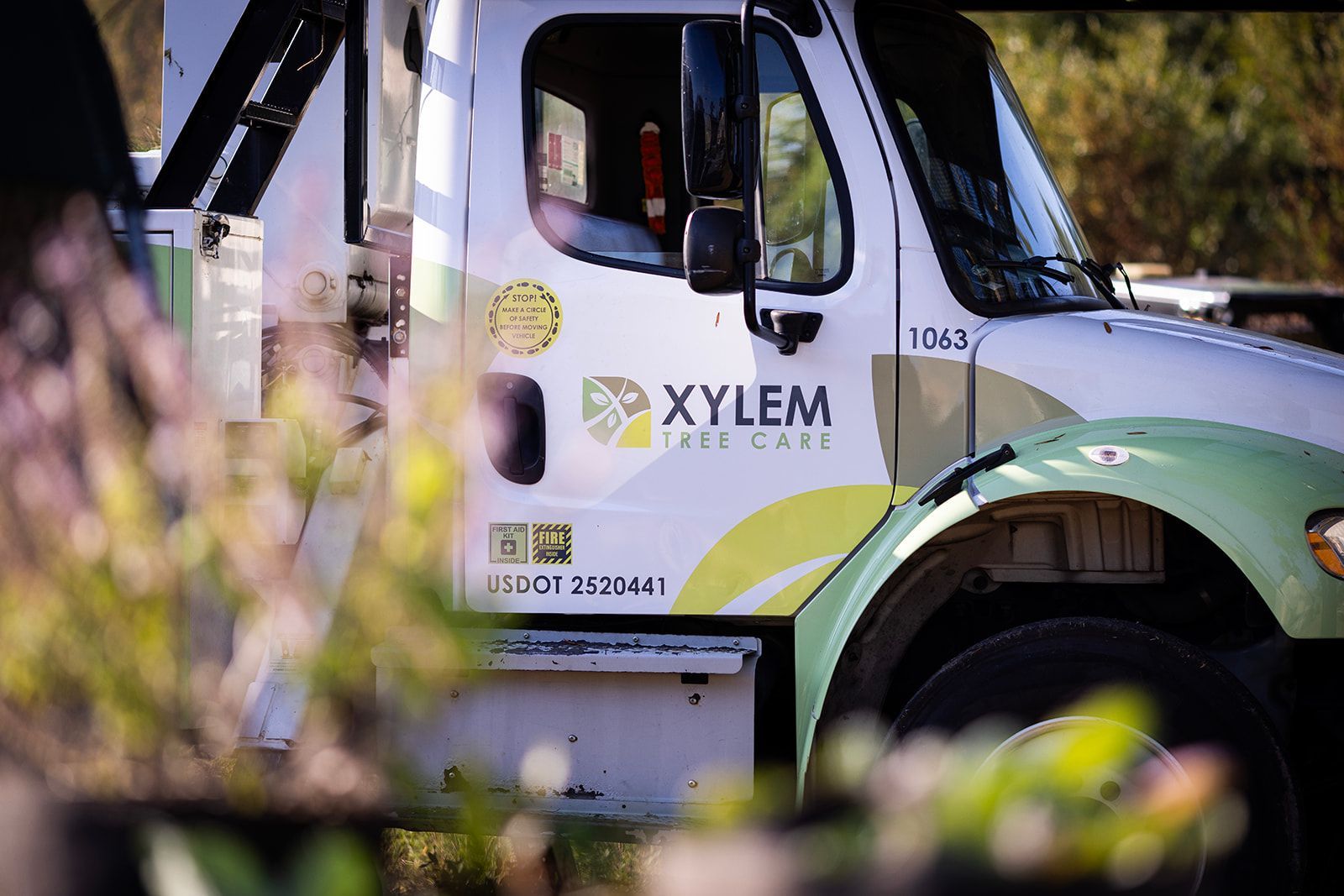 A white and green xylem tree care truck — Norfolk, VA — Xylem Tree Care