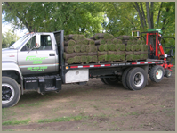 Truck loaded with grass — Gardening Supply in Crystal Lake, IL