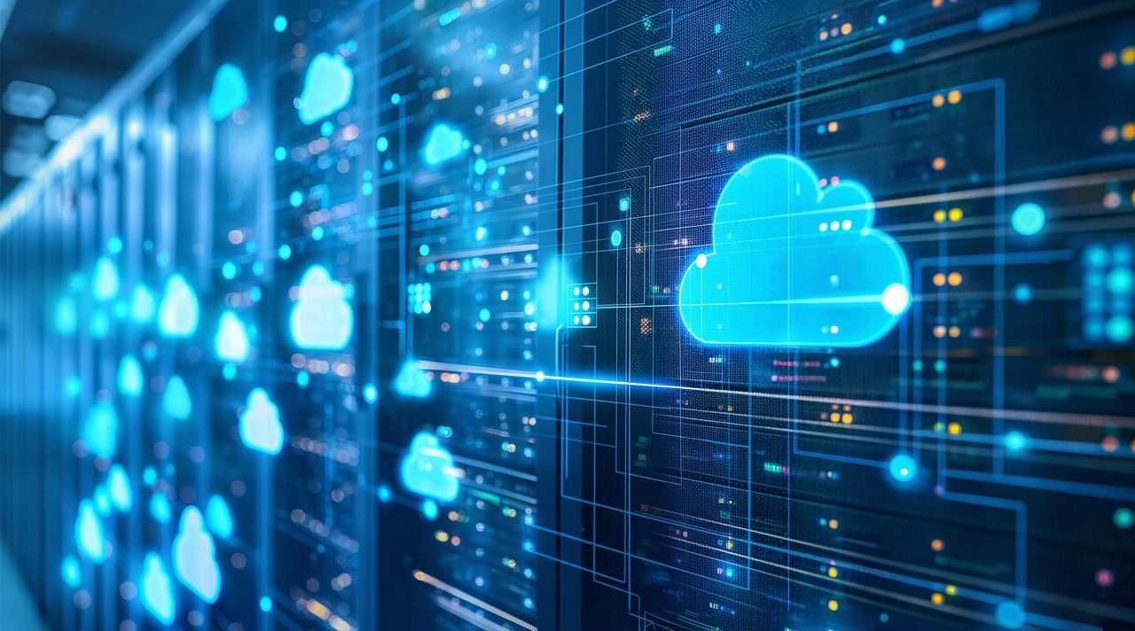 A row of servers in a data center with clouds floating in the background.
