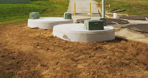 A Group of Septic Tanks Sitting on Top of a Dirt Field — Mid Coast Liquid Waste In Rainbow Flat, NSW