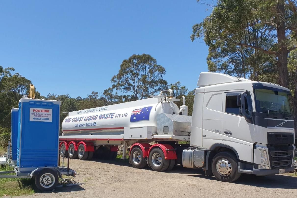 A White Truck With a Tanker Trailer Attached to It — Mid Coast Liquid Waste In Taree, NSW