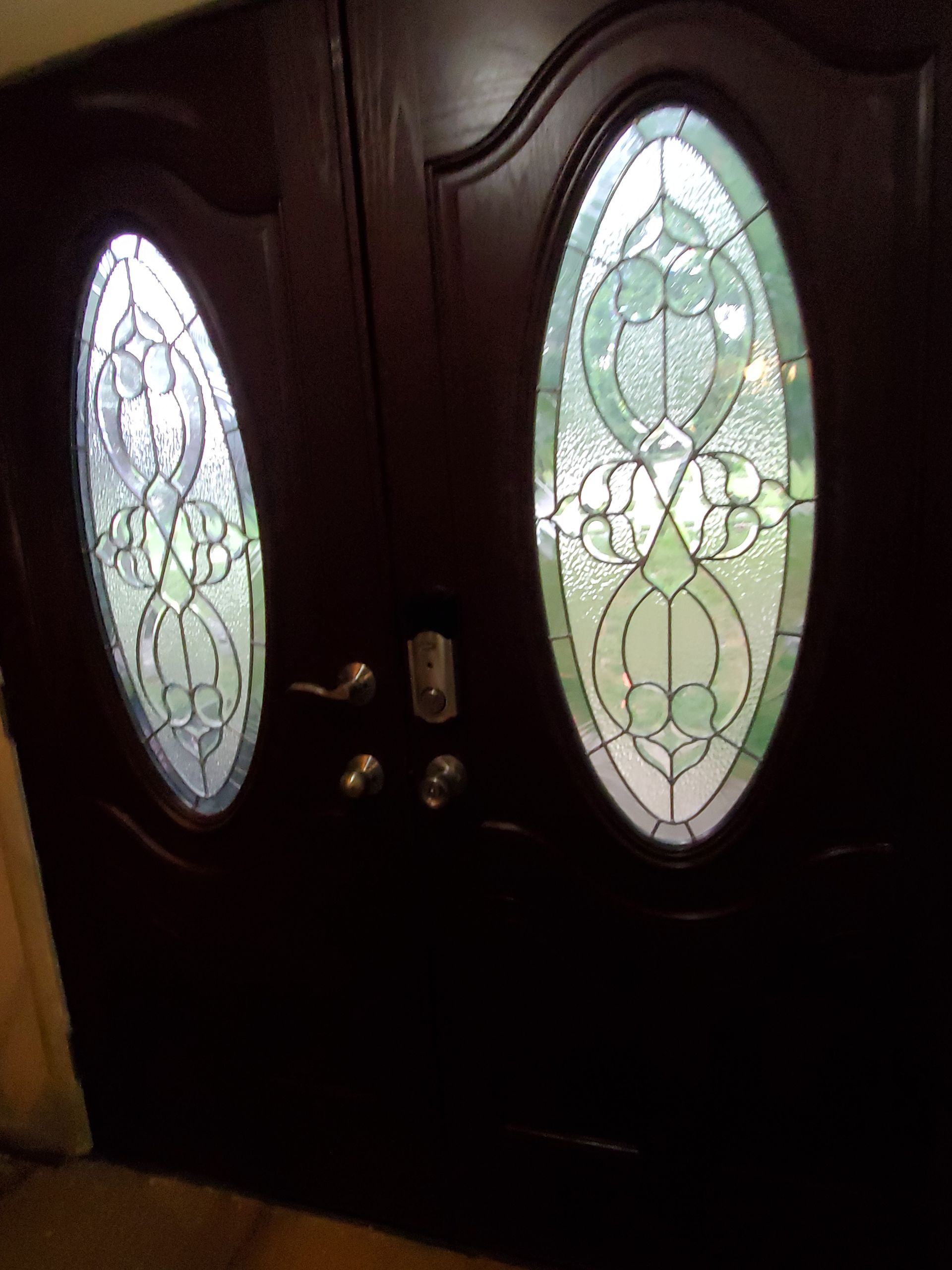 A close up of a door with stained glass windows