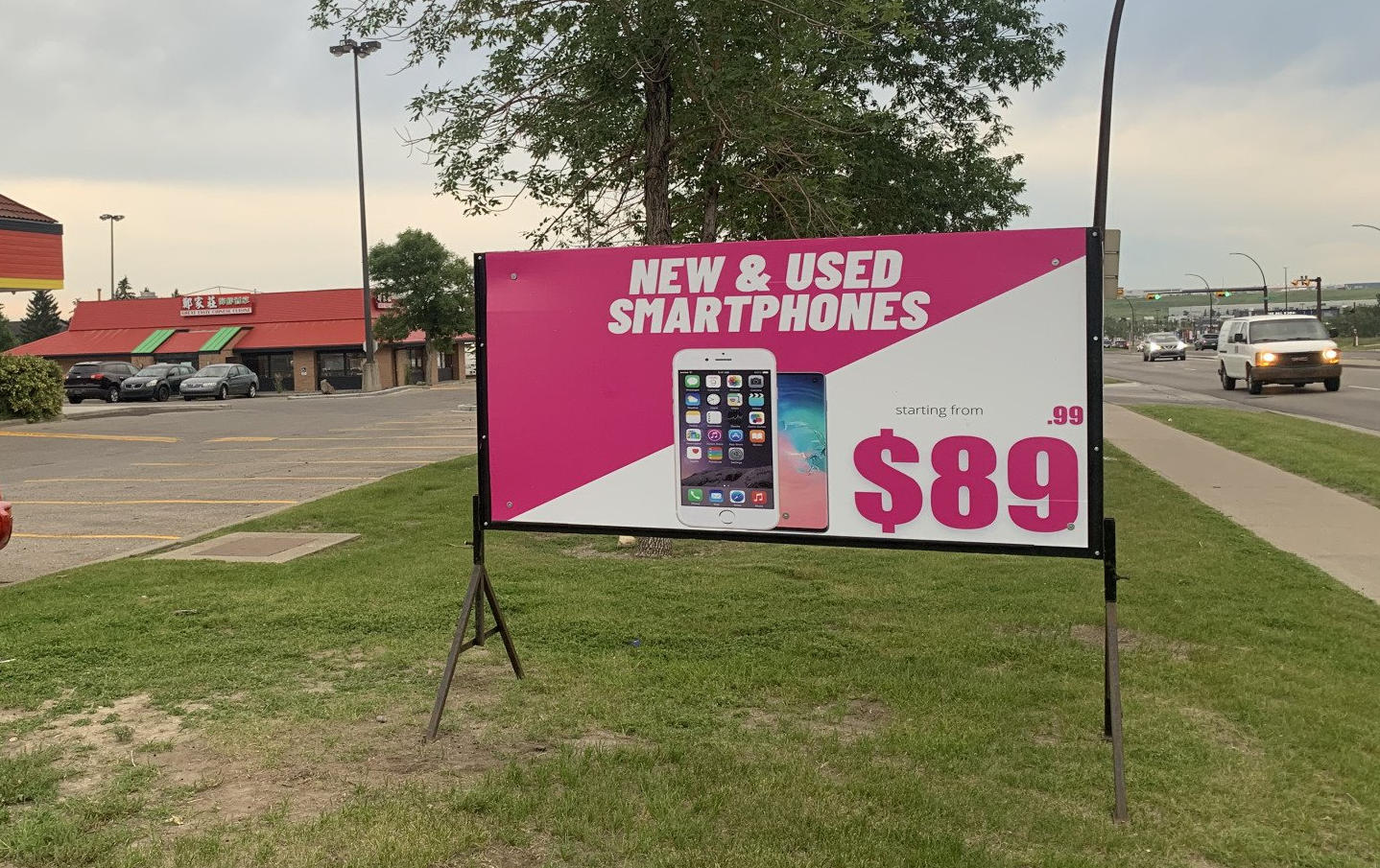 A billboard advertising new and used smartphones for $ 89