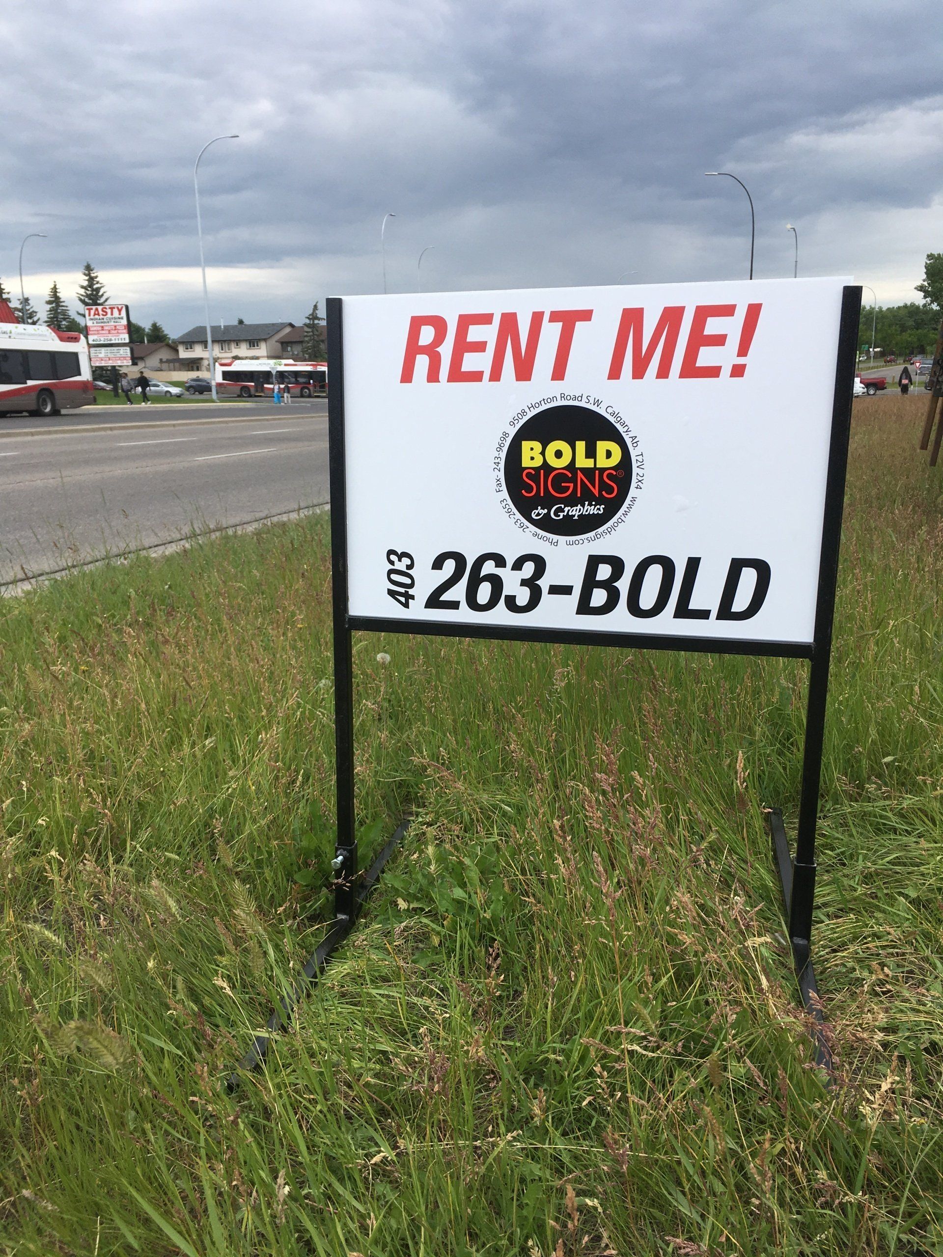 A sign on the side of a road that says rent me