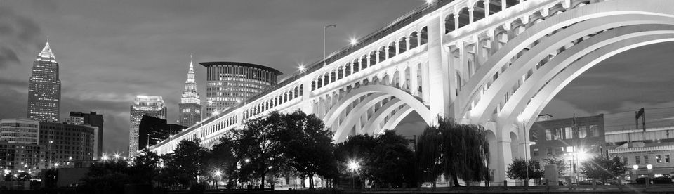 bridge and cleveland skyline at night in black and white