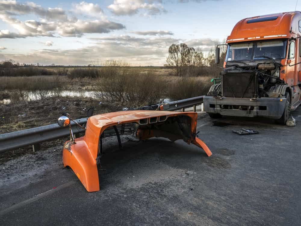 The Hood of a Semi Truck is Laying on the Side of the Road — Berrimah Radiator Service In Berrimah, NT