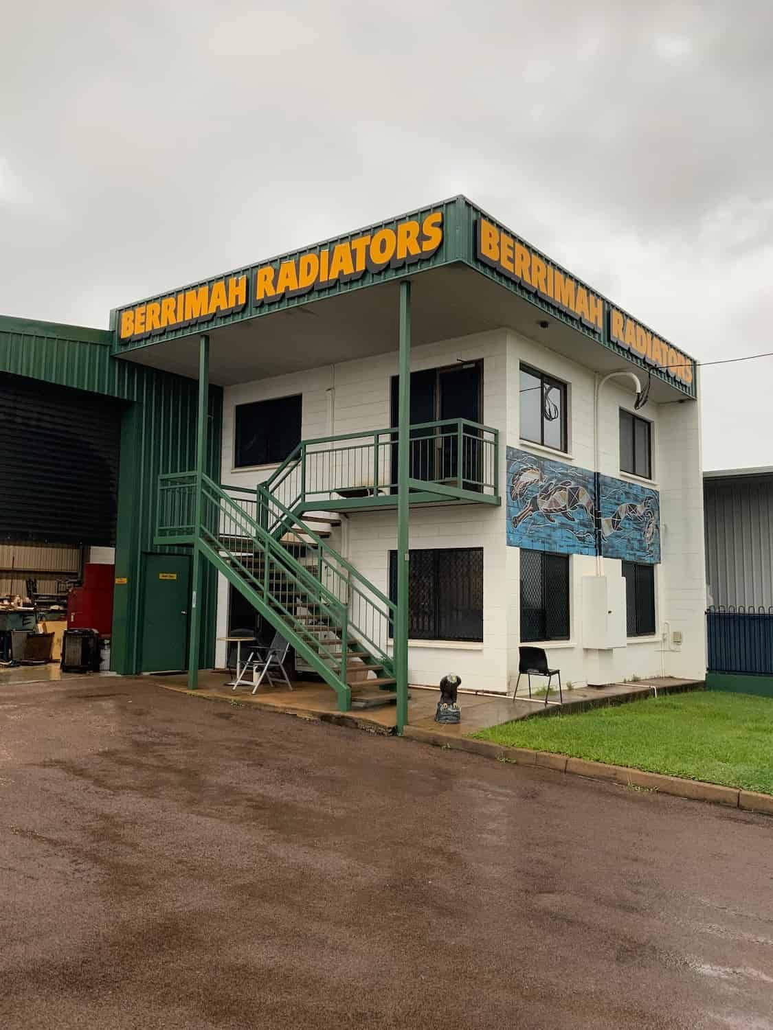 A Building With Stairs and a Sign That Says Radiators — Berrimah Radiator Service In Berrimah, NT