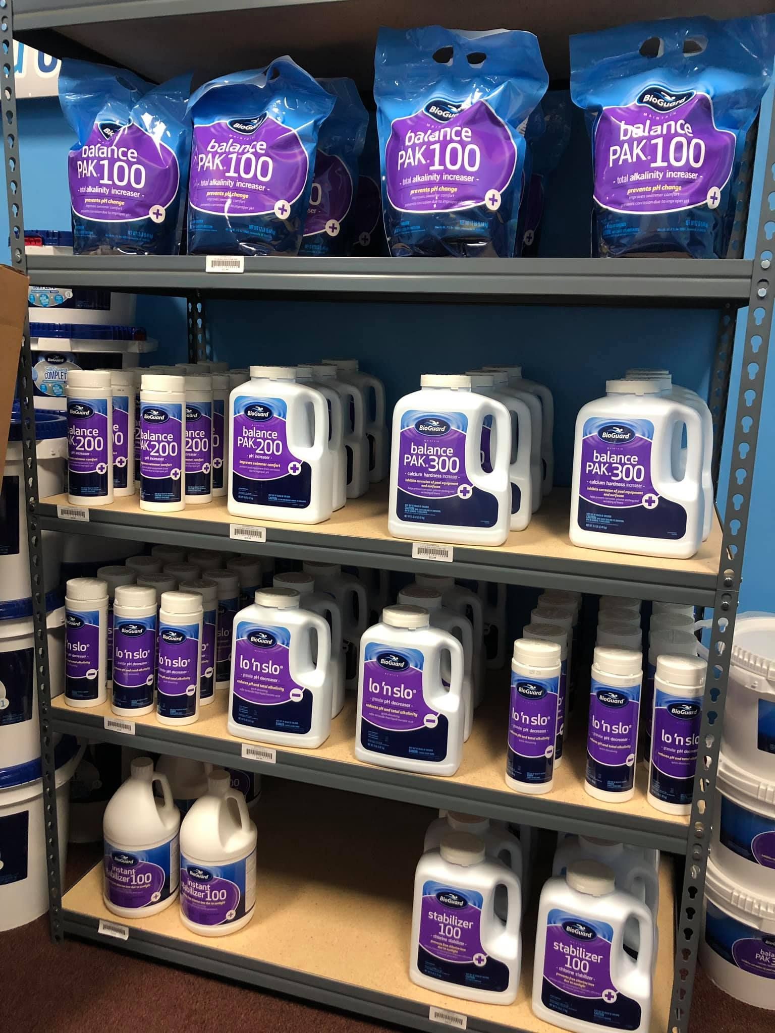 Shelves stocked with pool care products in various sizes and packaging.