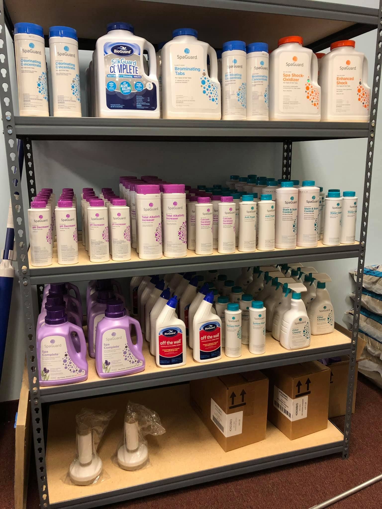 Metal shelving unit stocked with various cleaning and personal care products.