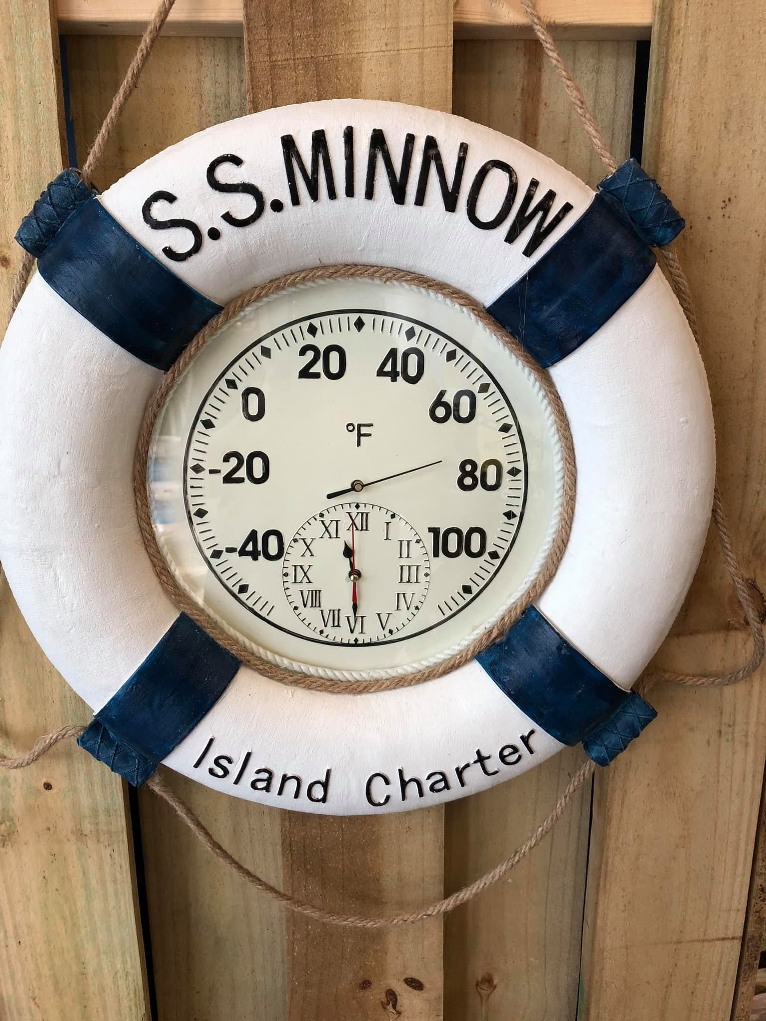 Thermometer shaped as a life preserver. Reads 