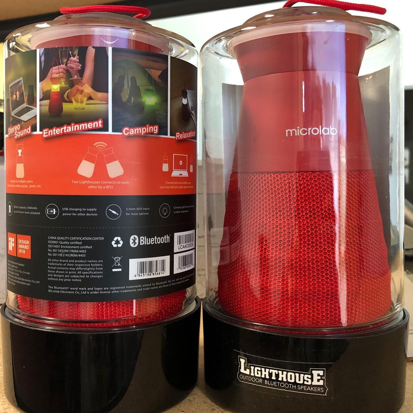 Two red Microlab Lighthouse Bluetooth speakers in packaging.
