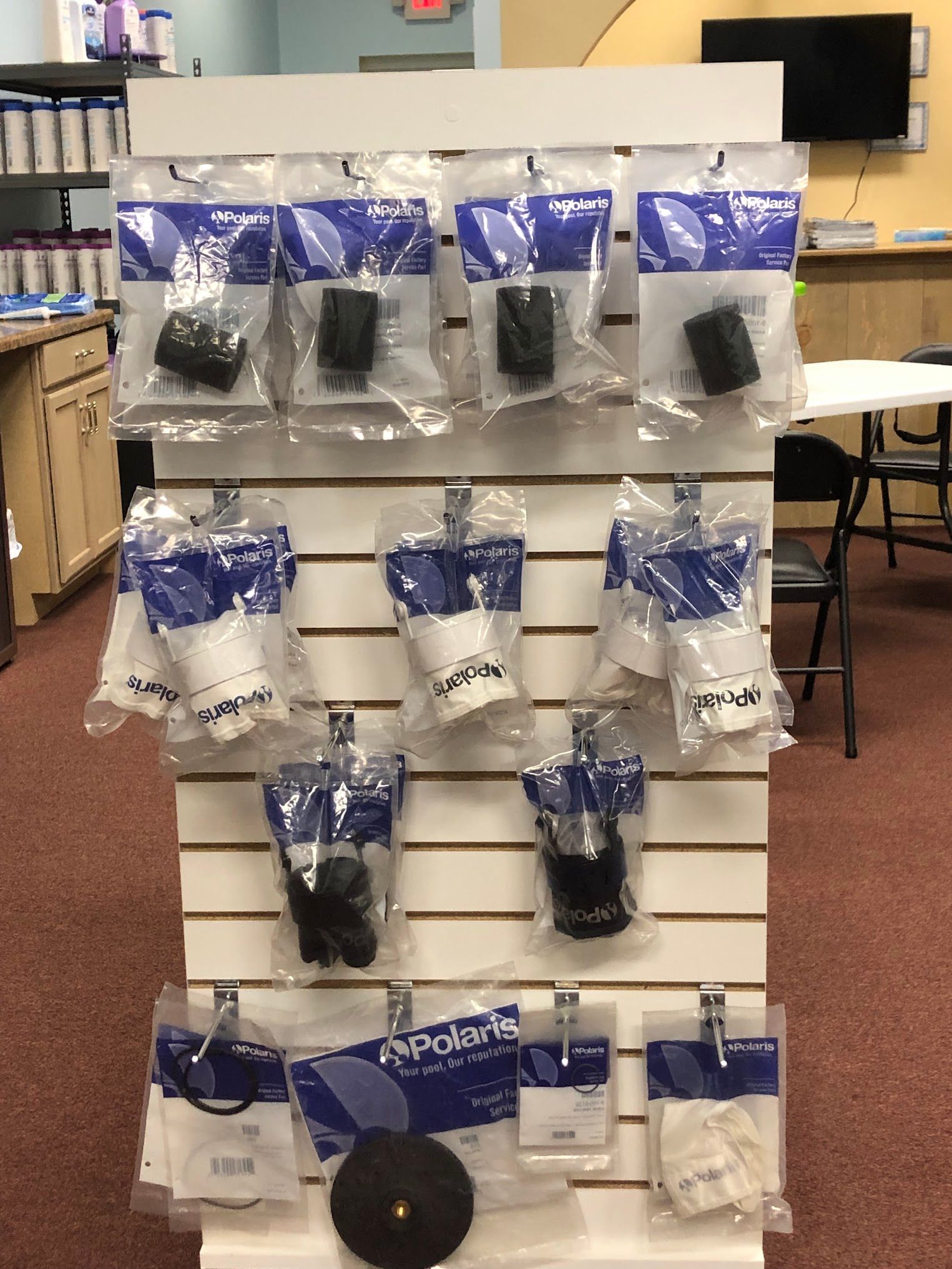 Display rack with various Polaris parts in sealed packages.