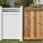 White and wood privacy fence panels in a suburban backyard, with white posts and lattice trim.