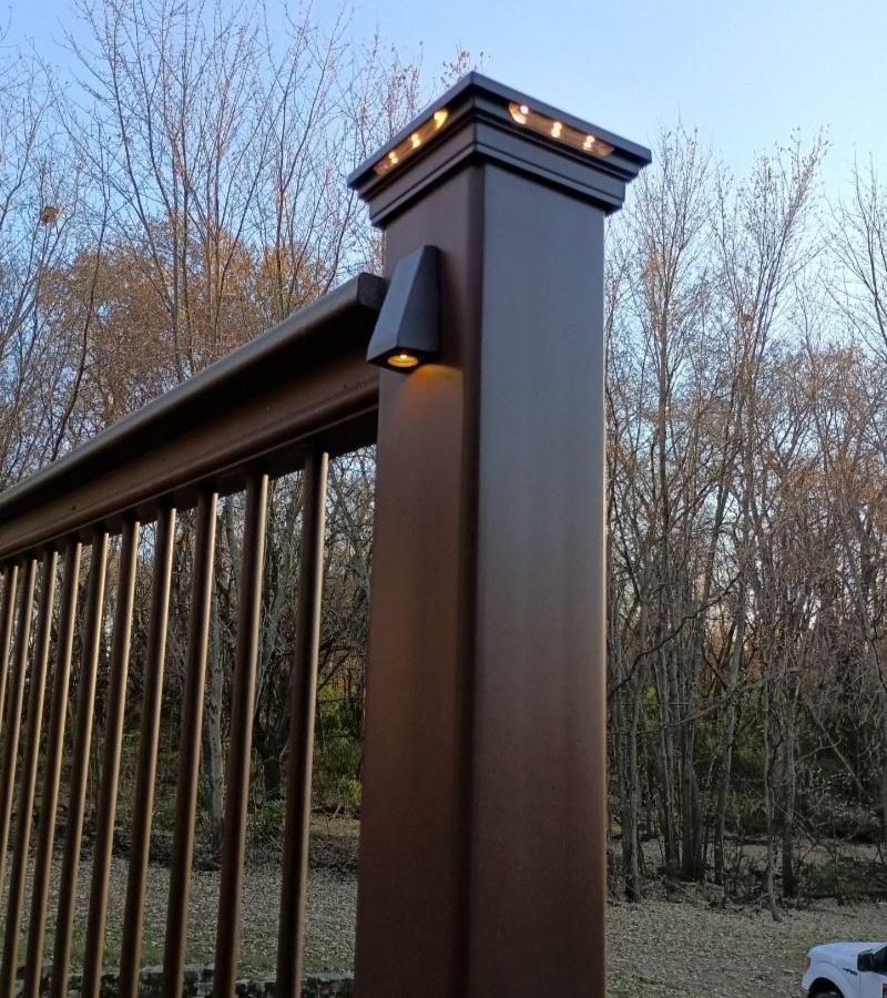 A wooden post with a light attached to it