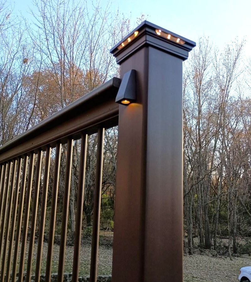 A wooden post with a light attached to it