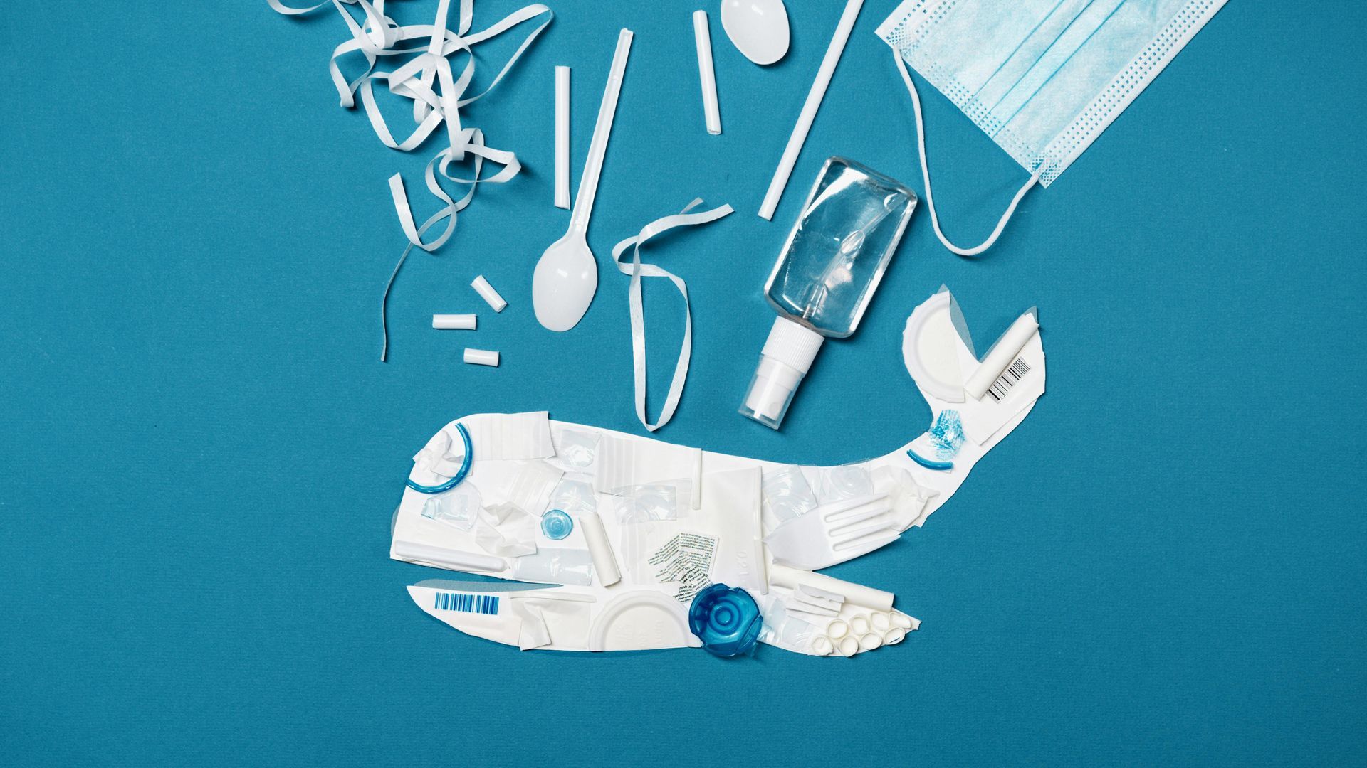 A variety of plastic items with a whale underneath