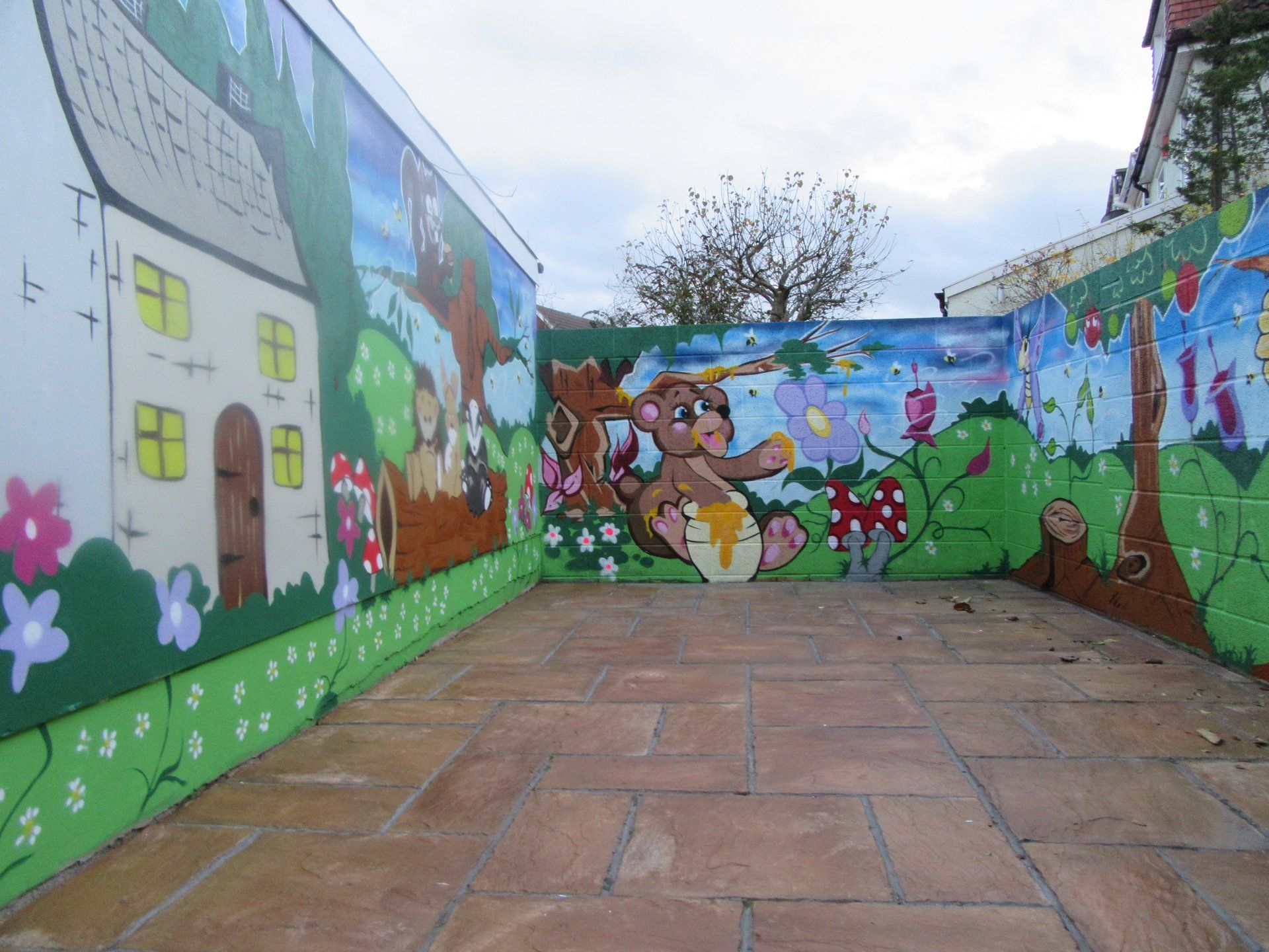 Garden wall graffiti mural in South Bristol