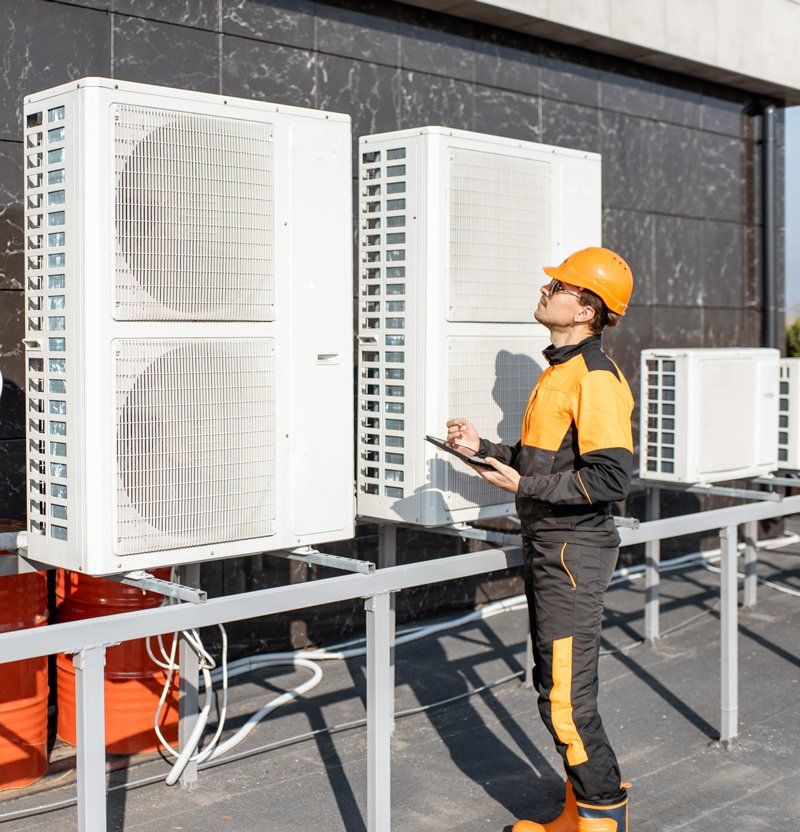 Technician Checking HVAC — Central Florida — A-Excellent Service Inc Technician Checking HVAC — Central Florida — A-Excellent Service Inc