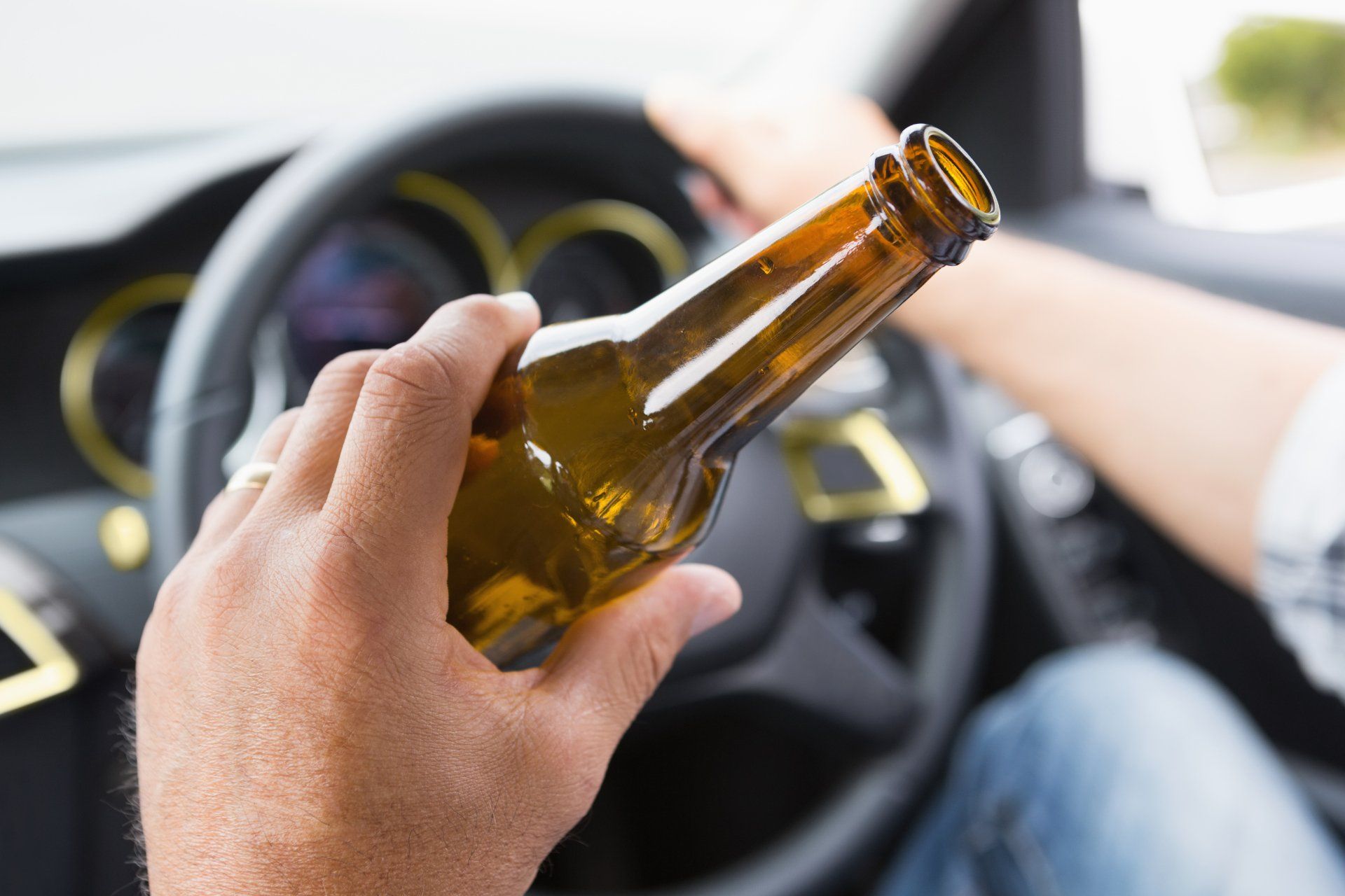 Driver Holding a Bottle of Beer — Columbus, GA — The Law Office of Paul Bennett