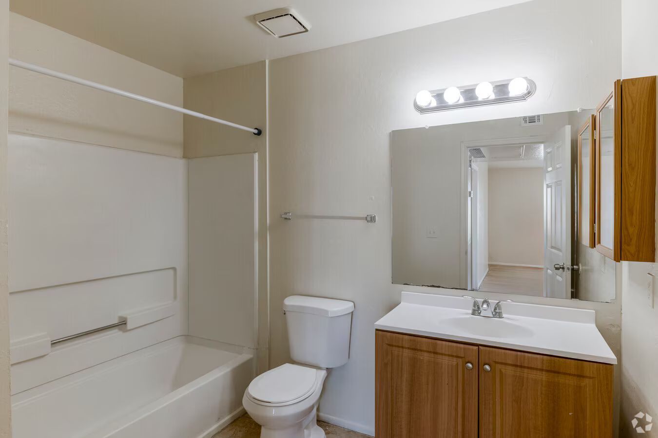 Photo of a bathroom with a bathtub/shower combination