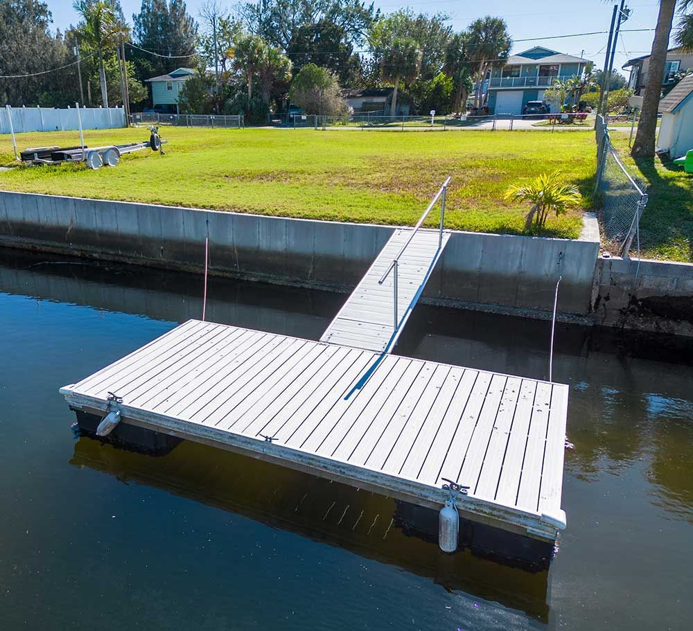 Floating boat dock with concrete sea wall in Florida 
