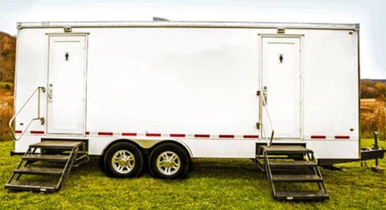Outside view of Presidential 8 Stall Restroom Trailer — Toilets Rental in Clarksville, NY