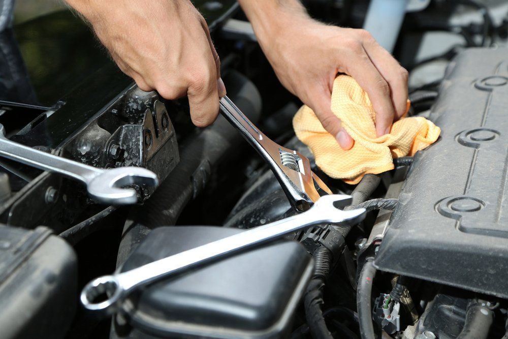 Mechanic Hand with wrench — Auto Electrician Near Me in Acacia Hills NT