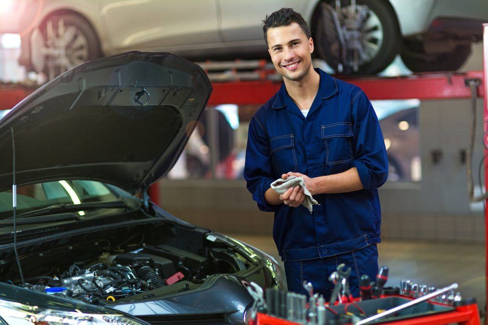 Happy Car mechanic in auto repair shop — Auto Electrician Near Me in Howard Springs NT