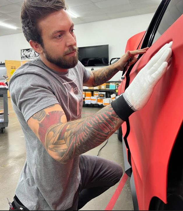 Man Applying Car Wrap — Maumelle, AR — Sticky Logistics