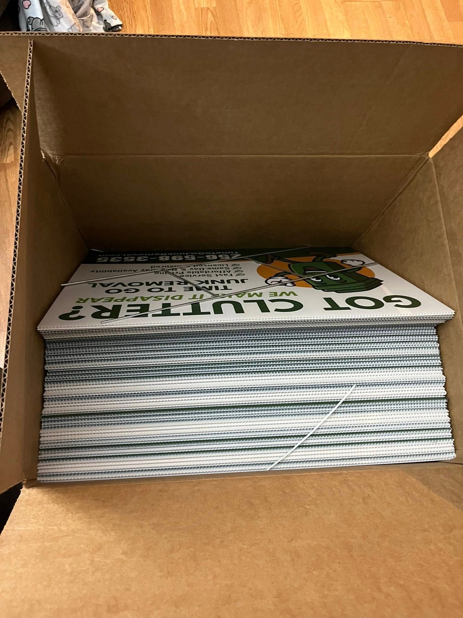 A box filled with a stack of brochures with a 