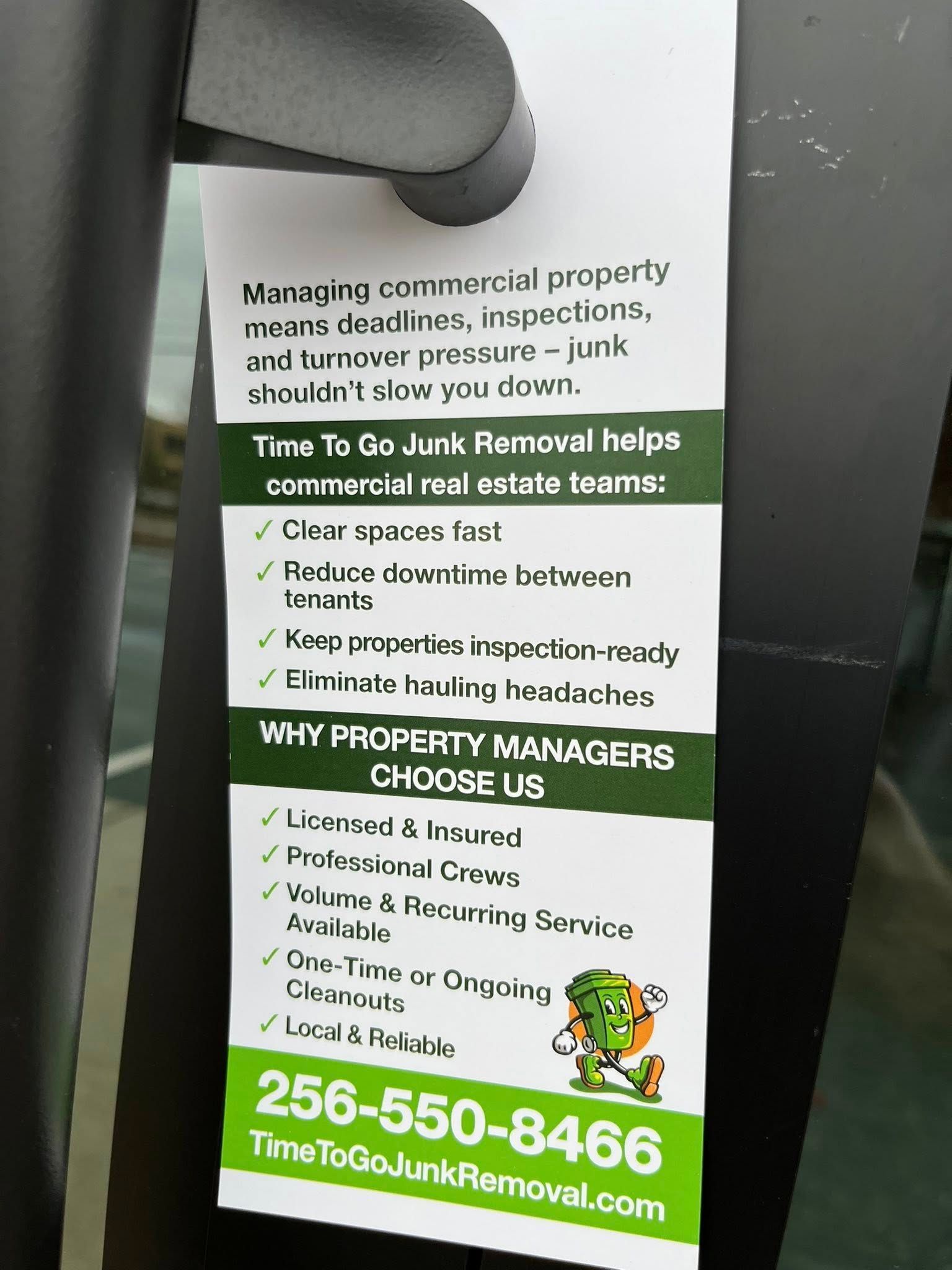 A white door hanger for Time To Go Junk Removal, listing commercial services and contact information with a green mascot.