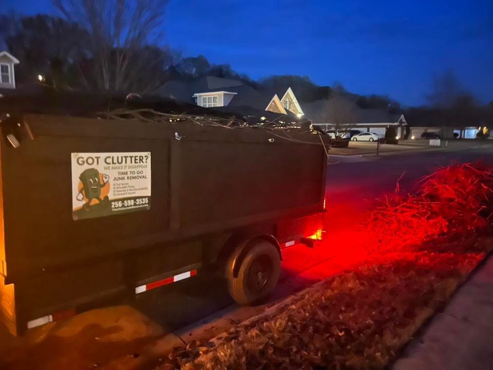 A black dump trailer labeled 