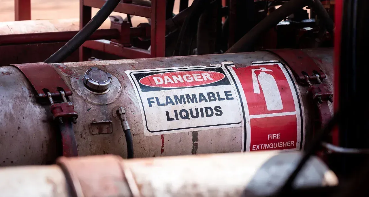 A horizontal metal tank labeled 