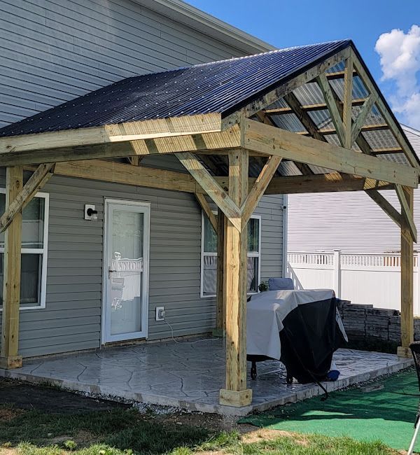 A house with a covered patio in front of it.