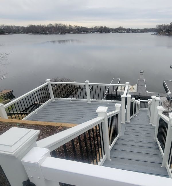 Stairs leading up to a deck overlooking a lake