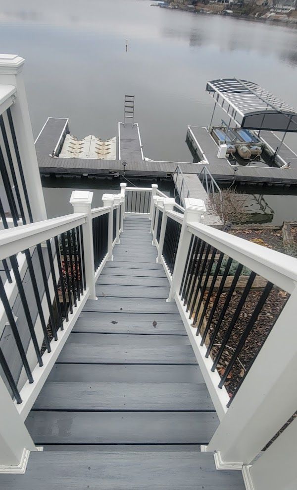 A set of stairs leading up to a dock on a lake.