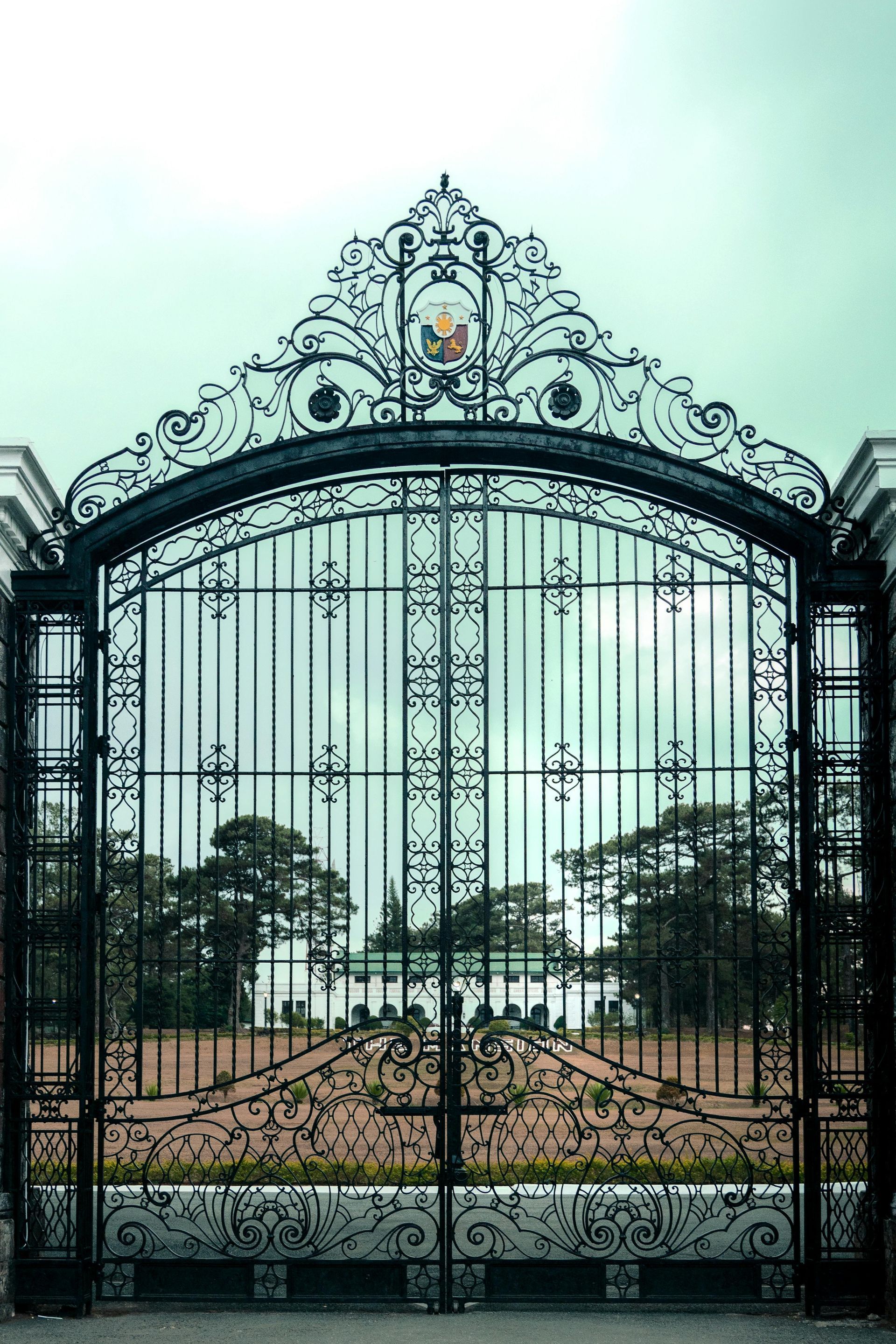 A large swimming pool is surrounded by a wooden deck.