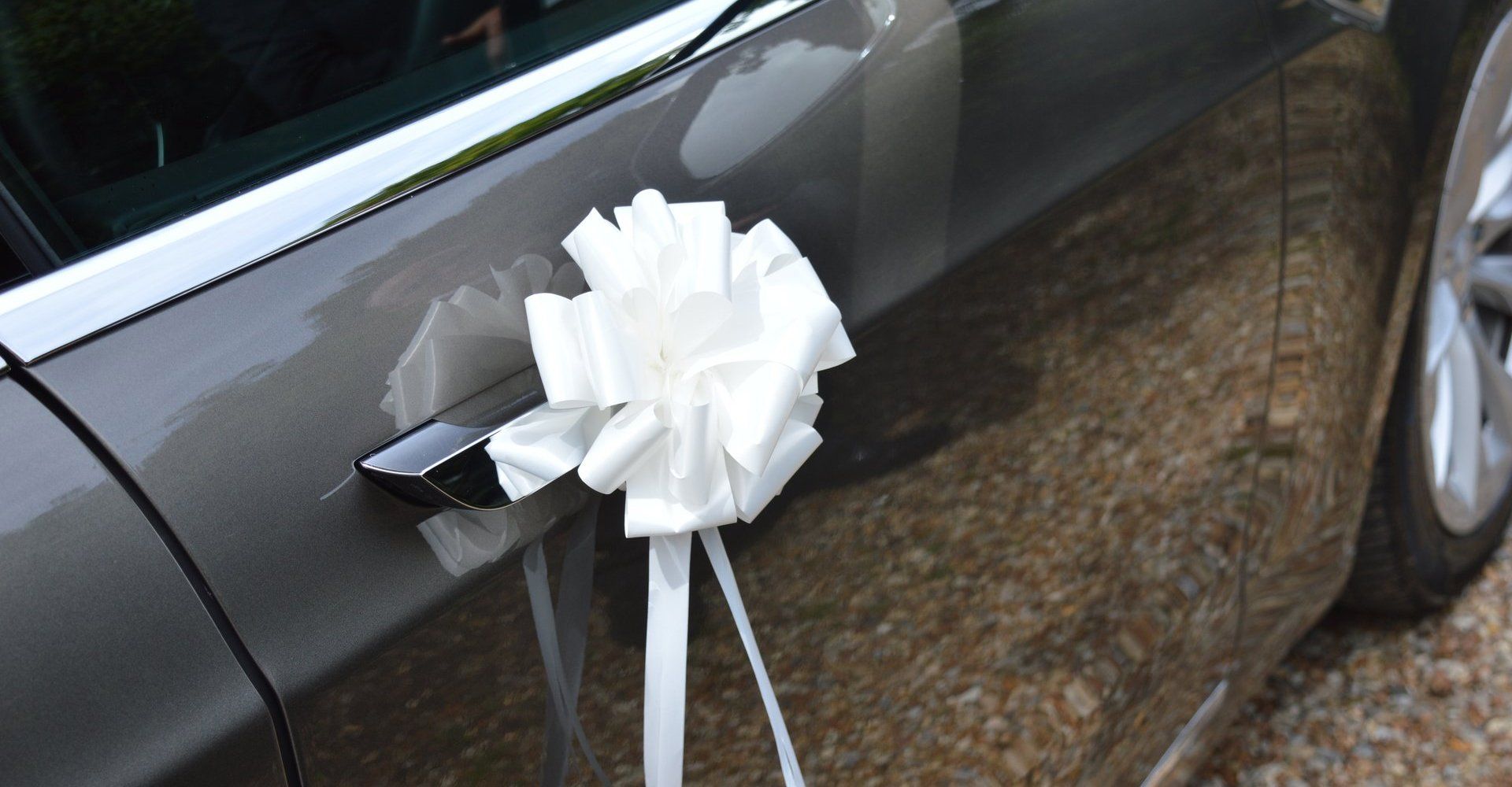 A white ribbon on car door