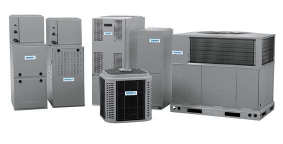 A group of air conditioners are sitting next to each other on a white background.