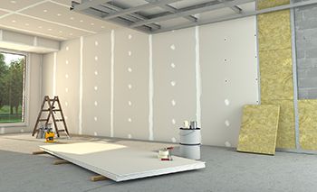 A room is being remodeled with drywall and insulation.