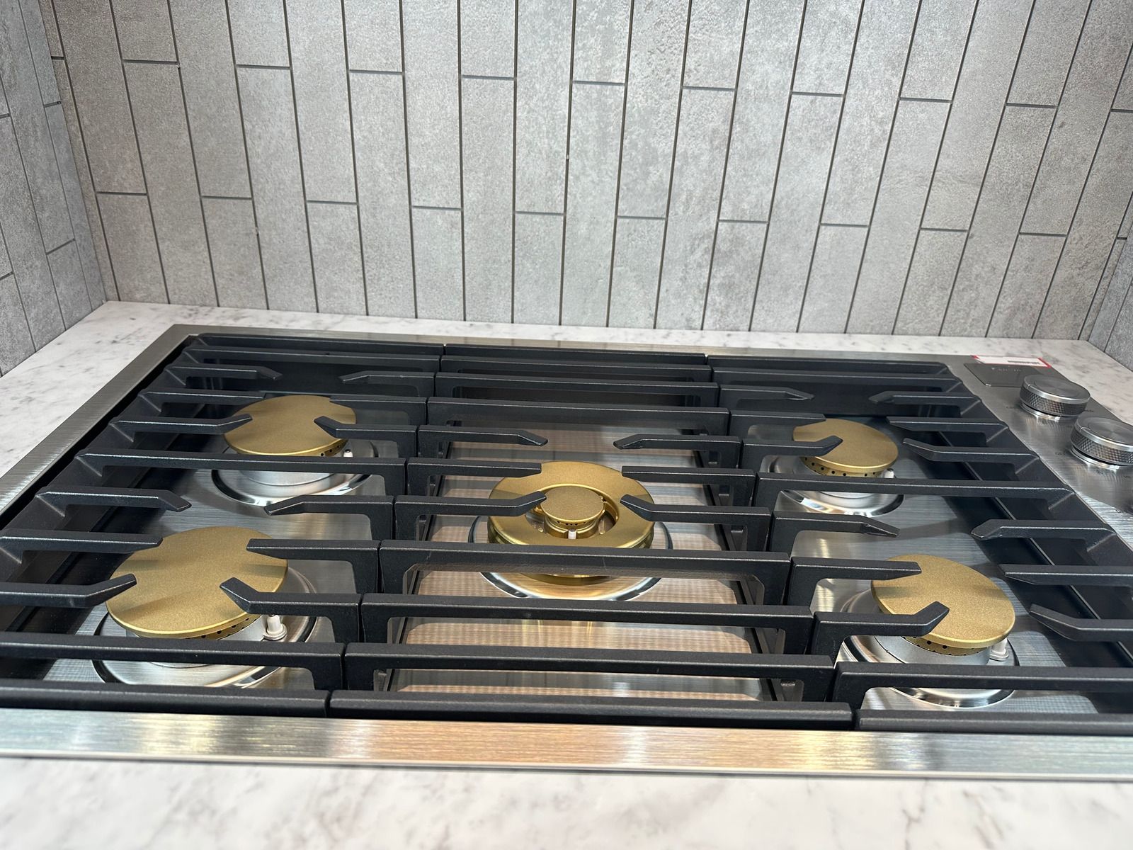 A wolf stove is sitting in a kitchen under construction