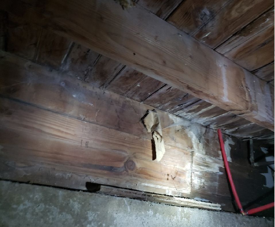 A piece of paper is laying on a wooden surface