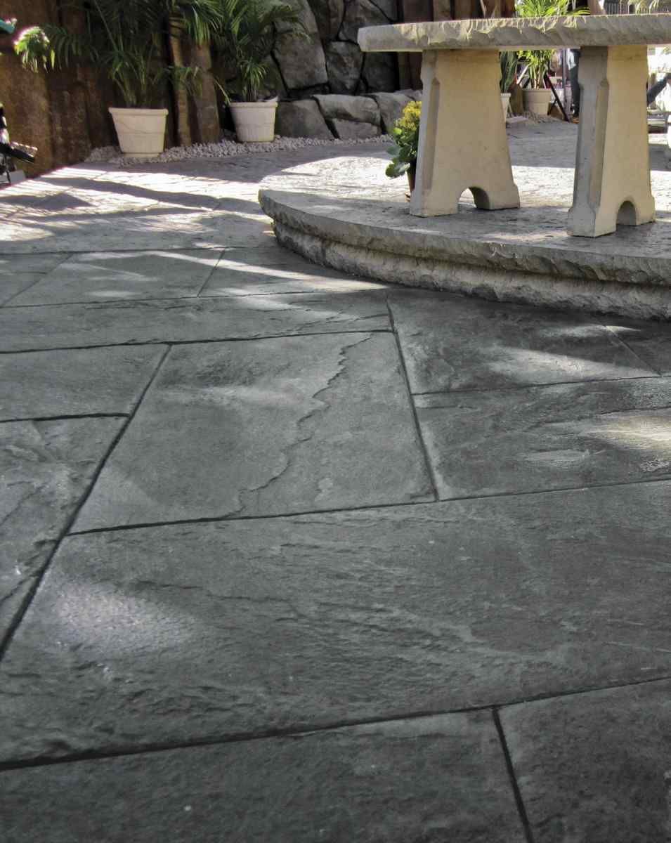 Gray Stamped Concrete In Backyard