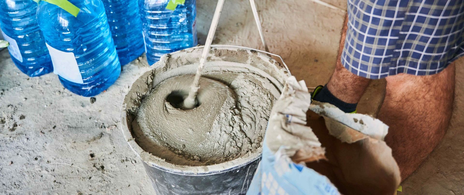 Homeowner Mixing Concrete For DIY Project